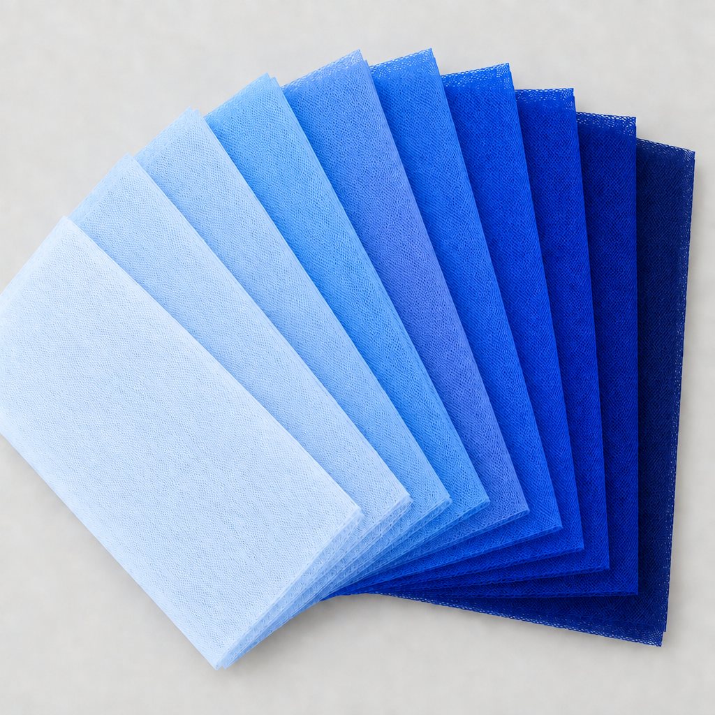 Nine blue tulle swatches in a square fan layout, with a light background and no words
