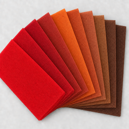 Nine red, orange, and brown tulle swatches in a square fan layout, with a light background and no words