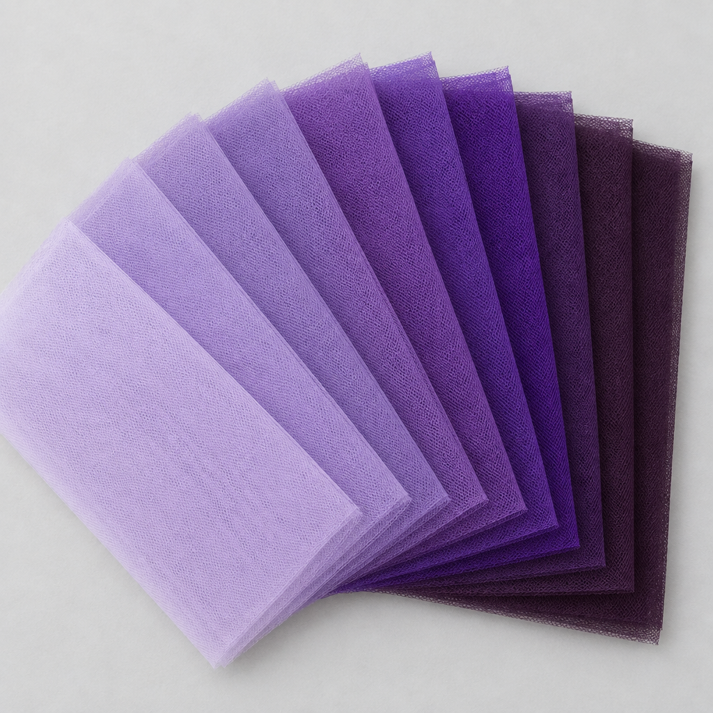 Nine shades of purple tulle from pale lavender to deep aubergine, square with no words