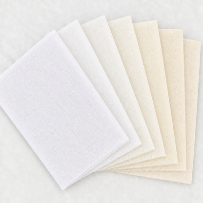 Six white and ivory tulle swatches in a square fan layout, with a light background and no words