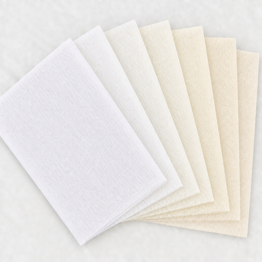 Six white and ivory tulle swatches in a square fan layout, with a light background and no words