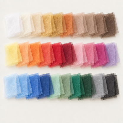 Thirty overlapping glimmer shimmer tulle swatches, square with a light background and no words